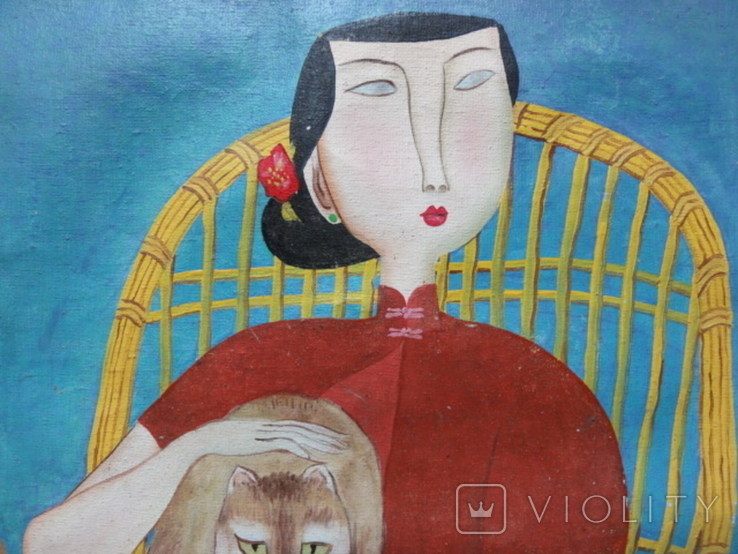 Девушка с котом в плетенном кресле Китай, фото №4
