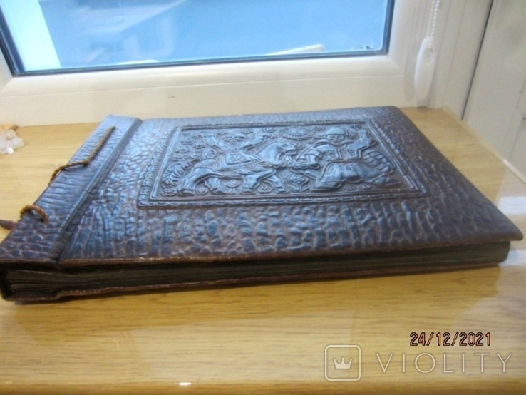 Vintage leather-bound photo album with artistic embossing, photo number 9