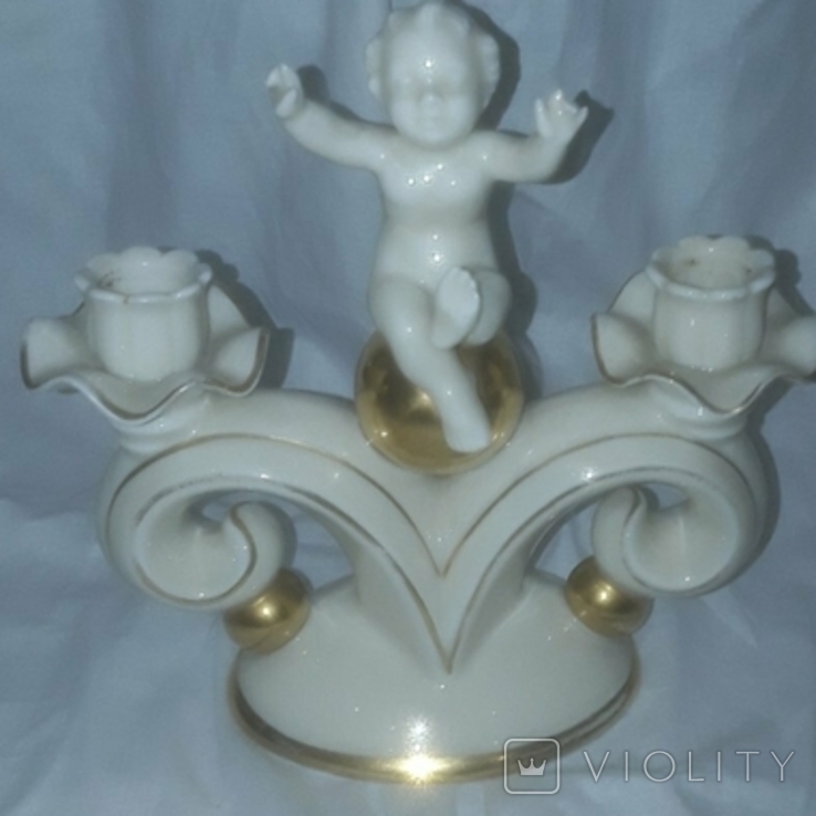Candlestick for two candles, a child with a golden ball, photo number 2