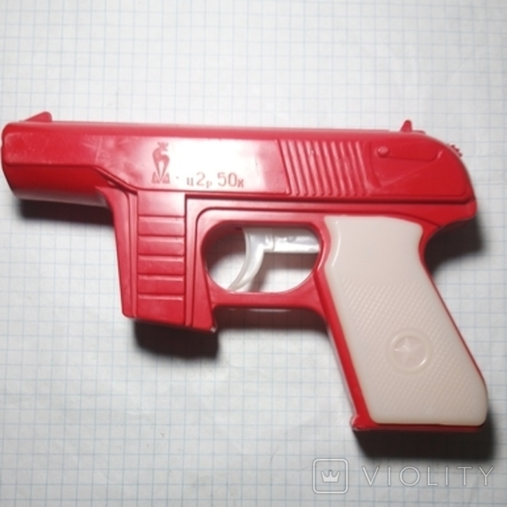 A pistol of the USSR, a toy, shoots discs (chips). Brand, worker.