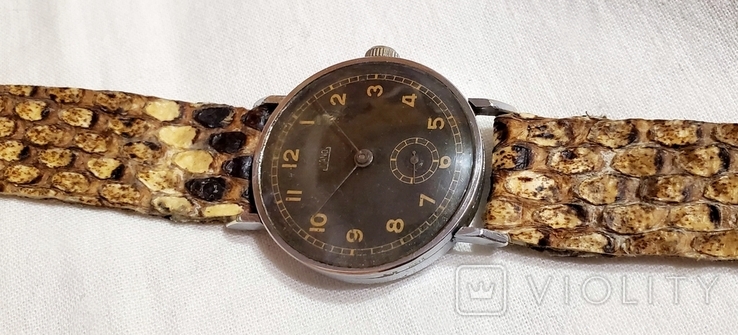 Swiss Nano watch with black dial on Swiss strap