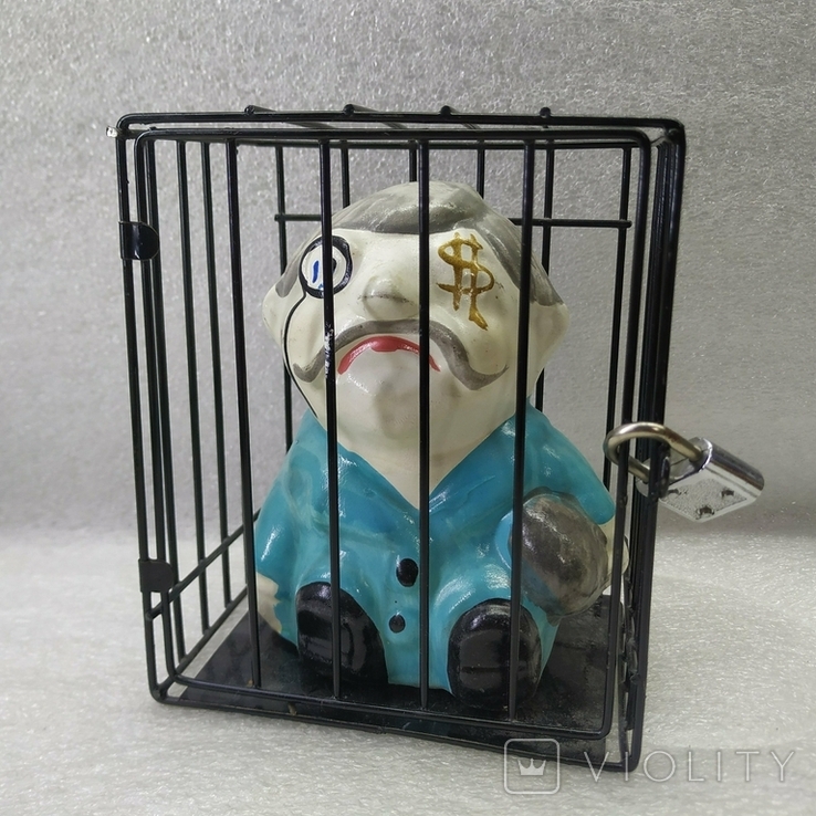 Piggy bank in a cage under lock and key., photo number 2