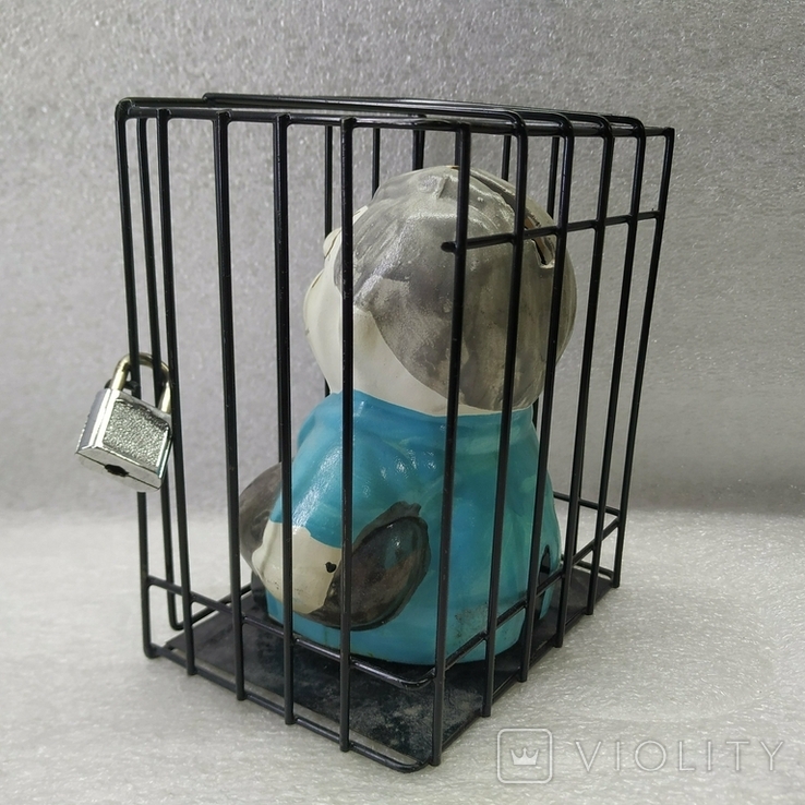Piggy bank in a cage under lock and key., photo number 10
