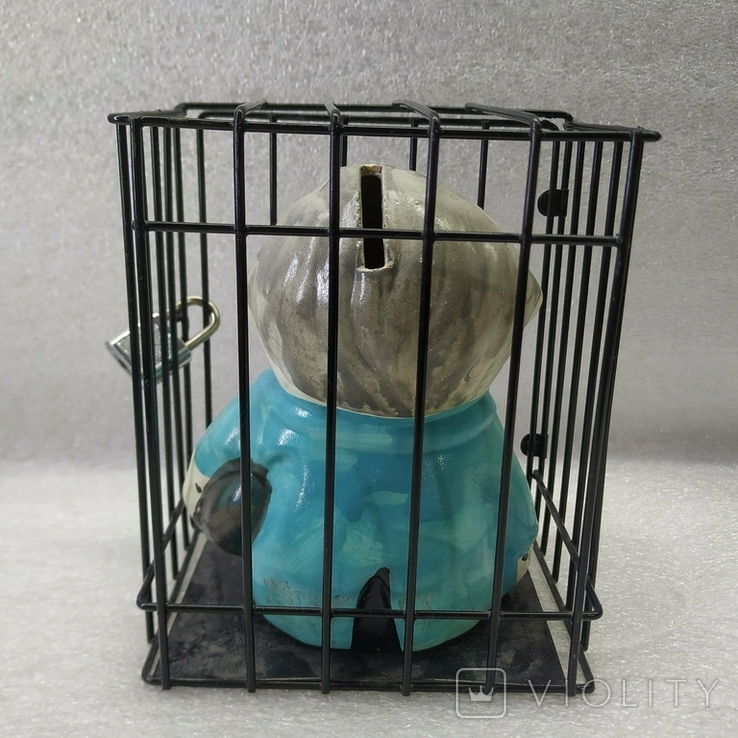 Piggy bank in a cage under lock and key., photo number 11