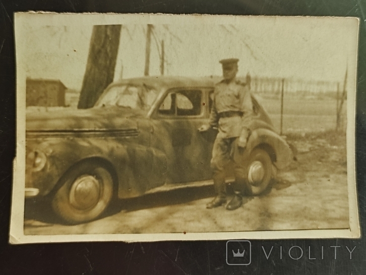 An old photo of an SA sergeant with a captured Opel Kapitan car., photo number 2