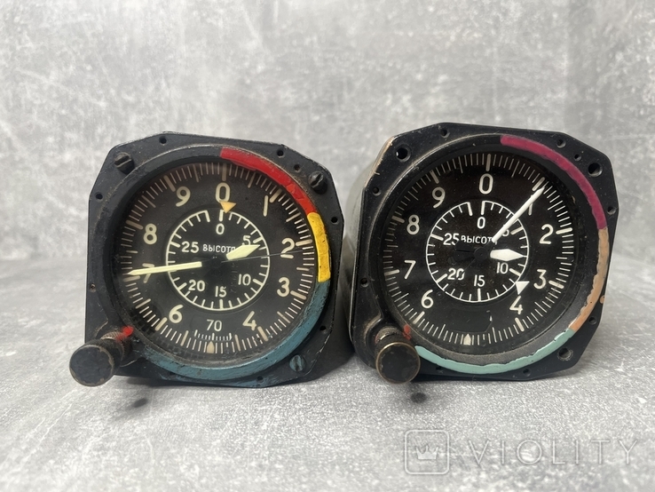 A pair of aviation altimeters