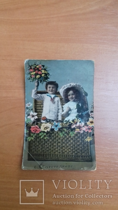 Открытка Австрия. Бельгия. 1909 г. Мальчик и девочка в корзине. Дети. Цветы