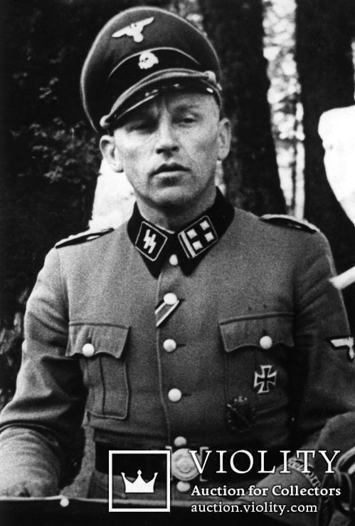 Оберштурмфюрер войск SS, награждён Железным Крестом и др. наградами рейха