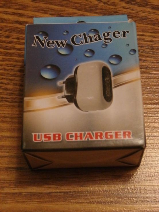 Сетевое зарядное устройство с USB выходом USB New Сharger 1А с подсветкой, фото №4