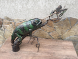 A chameleon on a branch hunting a butterfly, photo number 5