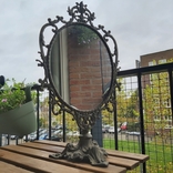 The mirror is old in a metal frame table., photo number 2