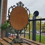 The mirror is old in a metal frame table., photo number 6