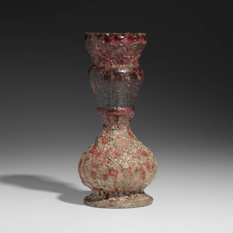 Exceptional vase by George Or with crimson, metallic, green and gray volcanic glaze, valued at ,000–,000.