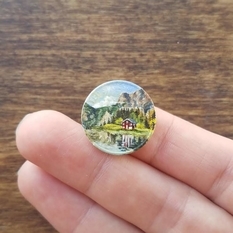 How are tiny landscapes created on coins?