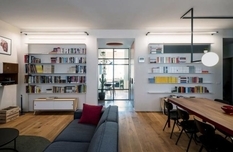 Studio Doppio designed an apartment for a writer from Turin with a multifunctional partition
