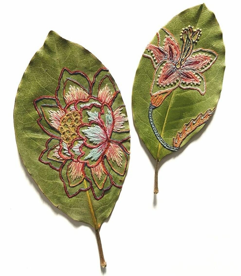 A needlewoman embroiders patterns on leaves from her own garden (Photo)