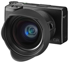 Ricoh GR III is a compact camera with a large sensor