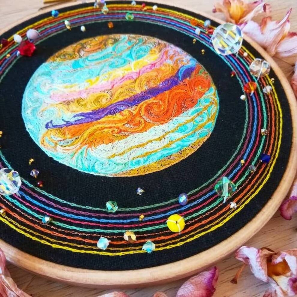 French woman depicts distant space using embroidery