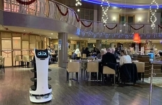 Robot cat serves customers in British restaurants